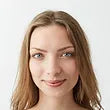 young beautiful blonde girl with blue eyes smiling